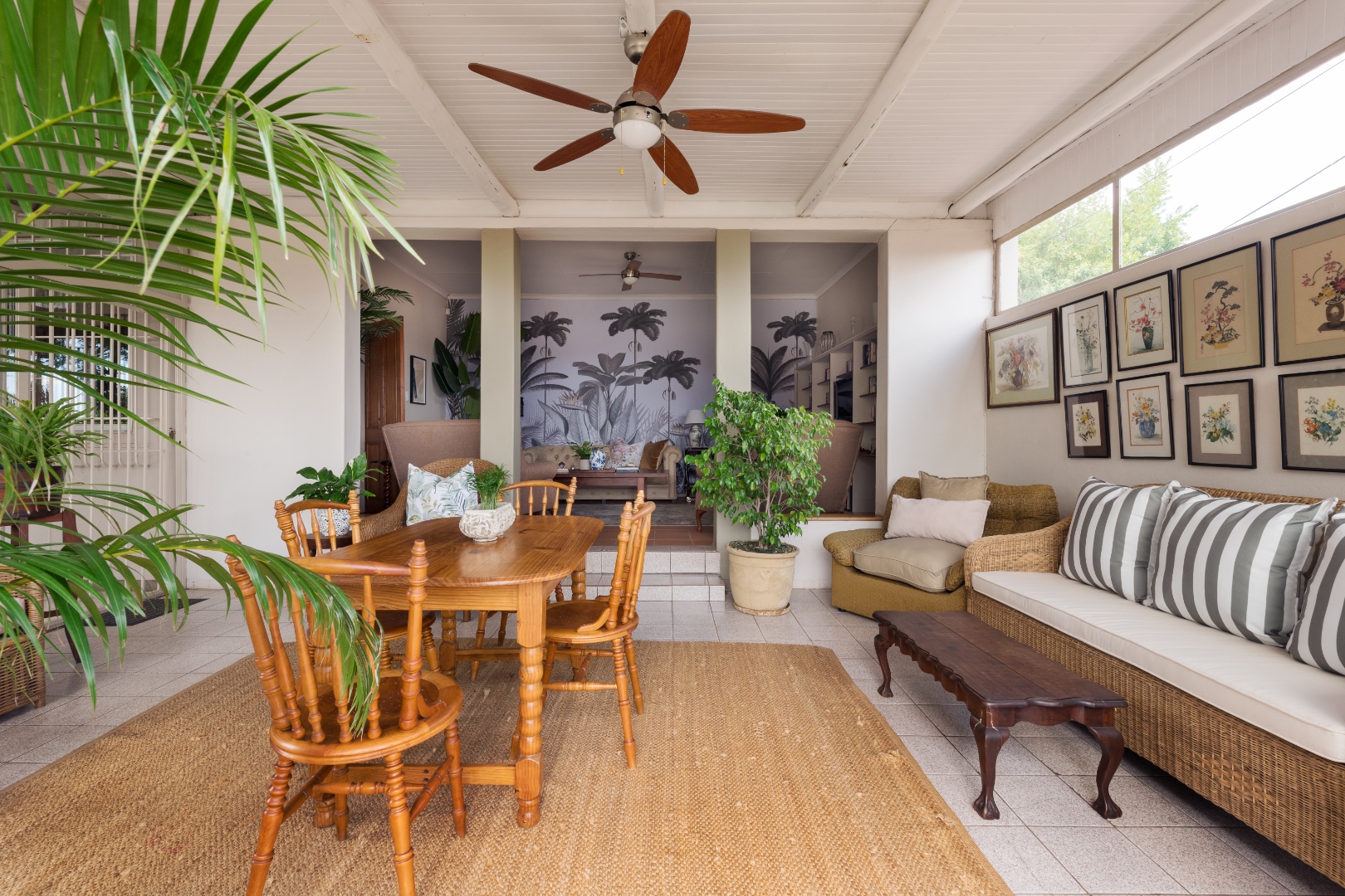 Covered veranda dining area with garden views